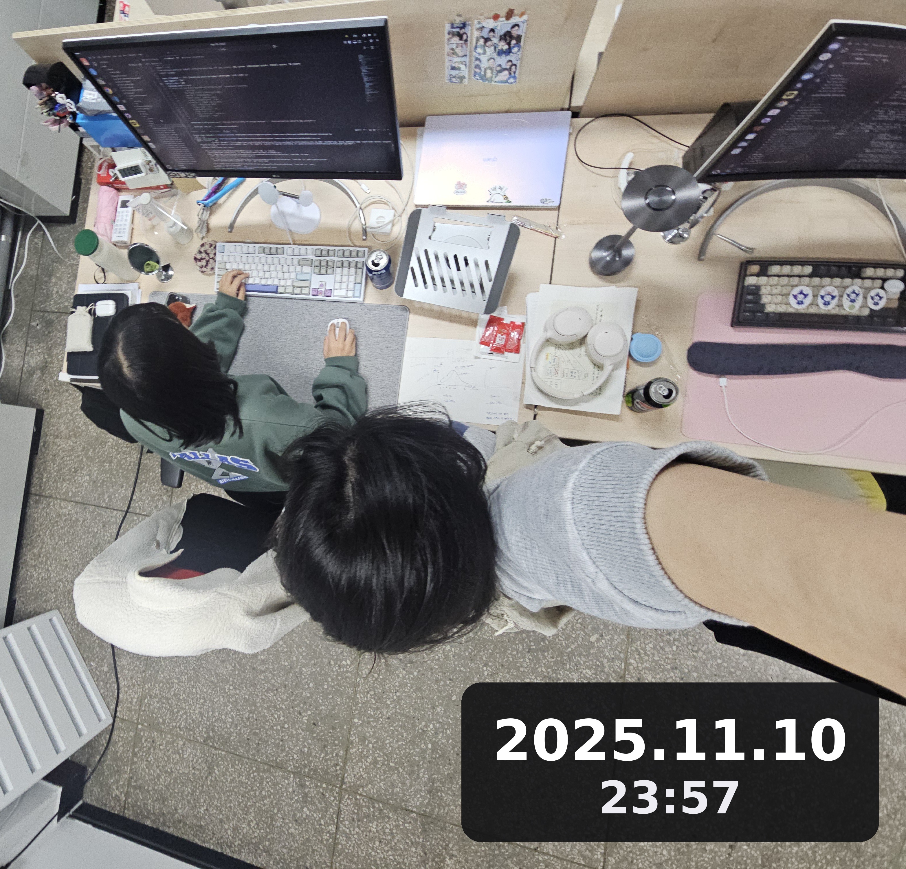 Eating dinner at the desk, right in front of the coding monitors, late at night.